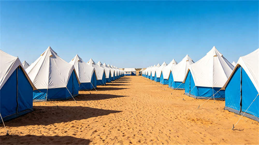 Bright well-lit tent interior with clean bedding solar lighting organized accommodation