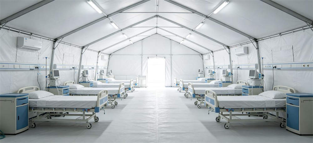 Interior of medical emergency tent with hospital beds and equipment