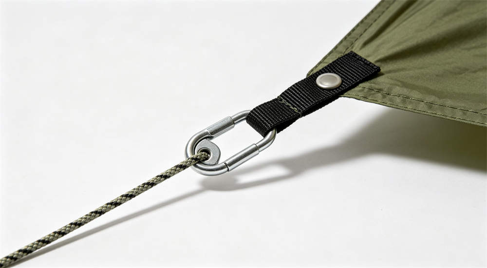 tent guyline tensioner and steel stake close up hardware