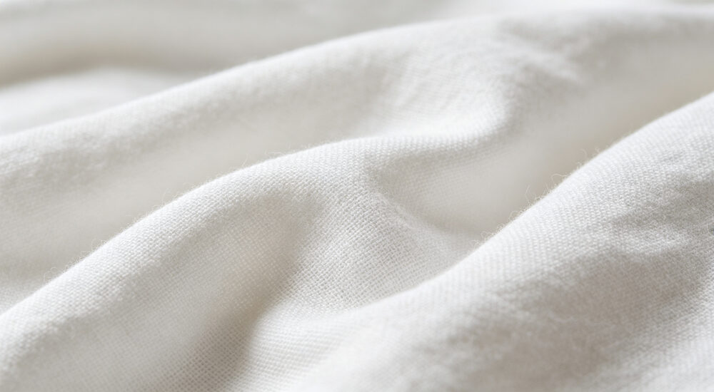 Institutional bedding product display showing material quality and design details for commercial procurement decision making suitable for emergency shelters hospitals universities and hotels requiring durable comfortable bedding solutions