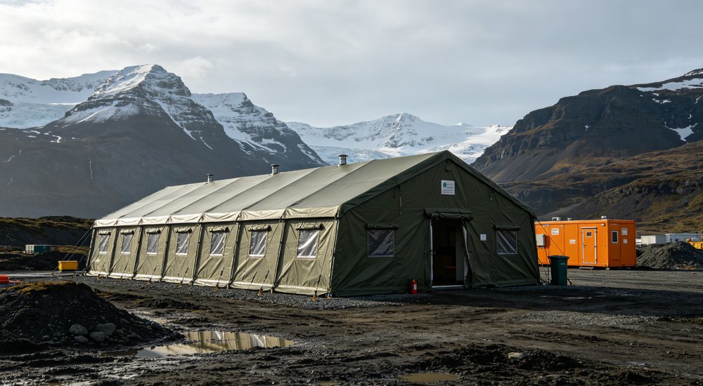 Heavy duty emergency frame tent displayed in operational setting demonstrating quick setup capability durable canvas exterior and spacious interior capacity for humanitarian relief missions