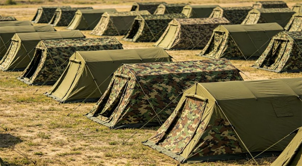 Military camouflage tent camp for field deployment and troop accommodation